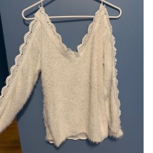 Long sleeve off the shoulder fuzzy top.